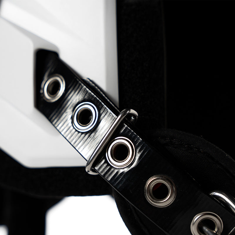 Battle Defender Youth shoulder pads closeup of the belt strap and grommet hardware