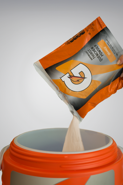 Gatorade powder mixed in team cooler for sideline hydration